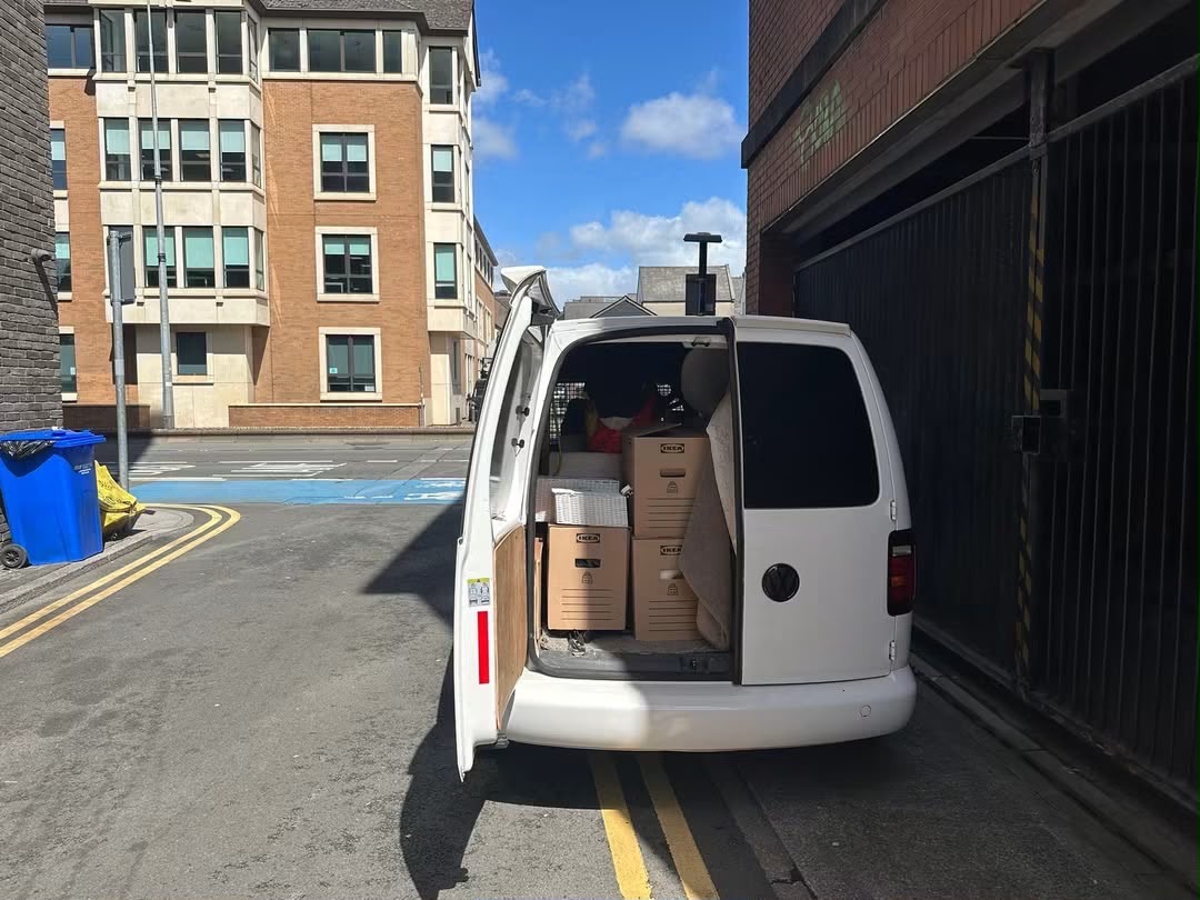 Van loaded with flat-pack boxes on a Cardiff city street