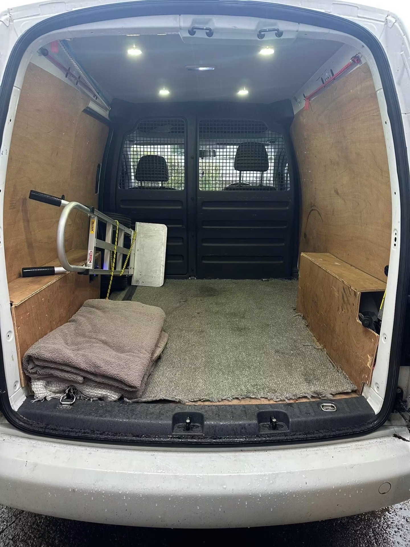 Clean van load space with blankets, straps and sack truck